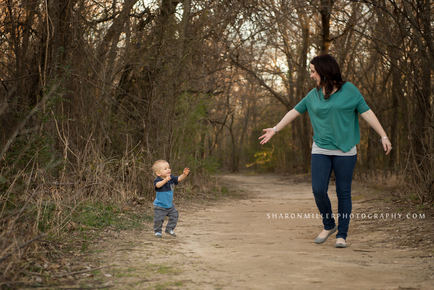 one year old walking down Colleyville Nature Center trail with mother